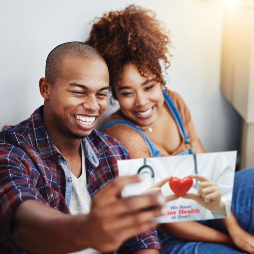 couple looking at coupon postcard