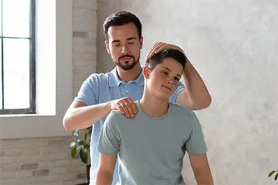 chiropractor working on young patient